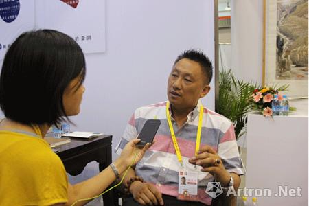 福建倚天艺术品投资公司总经理江韬接受采访