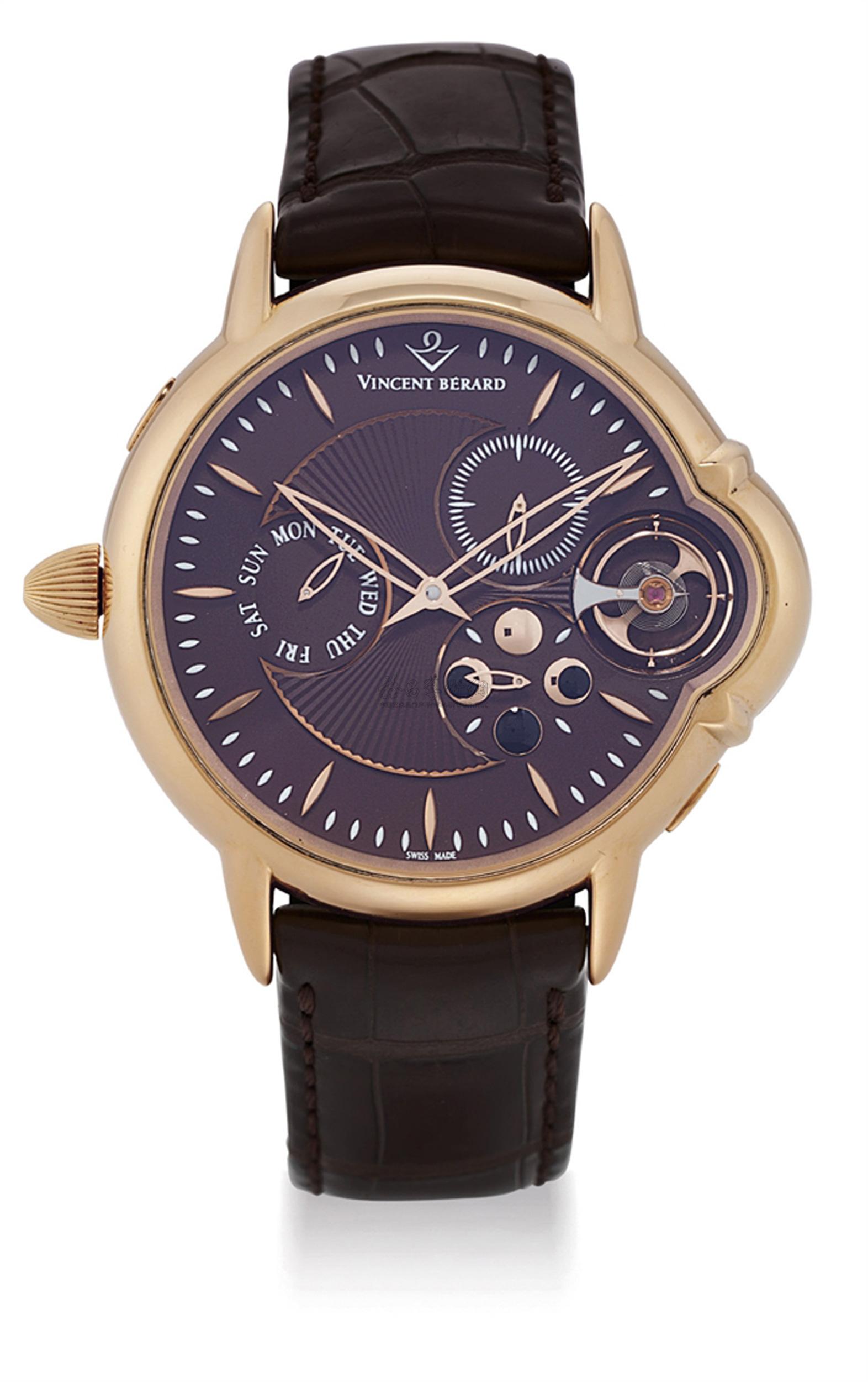 a large 18k pink gold left-handed wristwatch